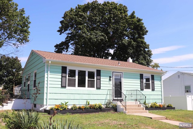 front view of a house with a yard