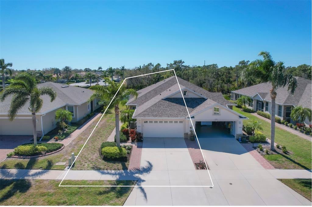 a aerial view of a house with a yard