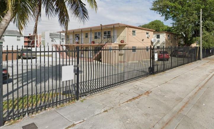 a view of a wrought iron fences in front of house