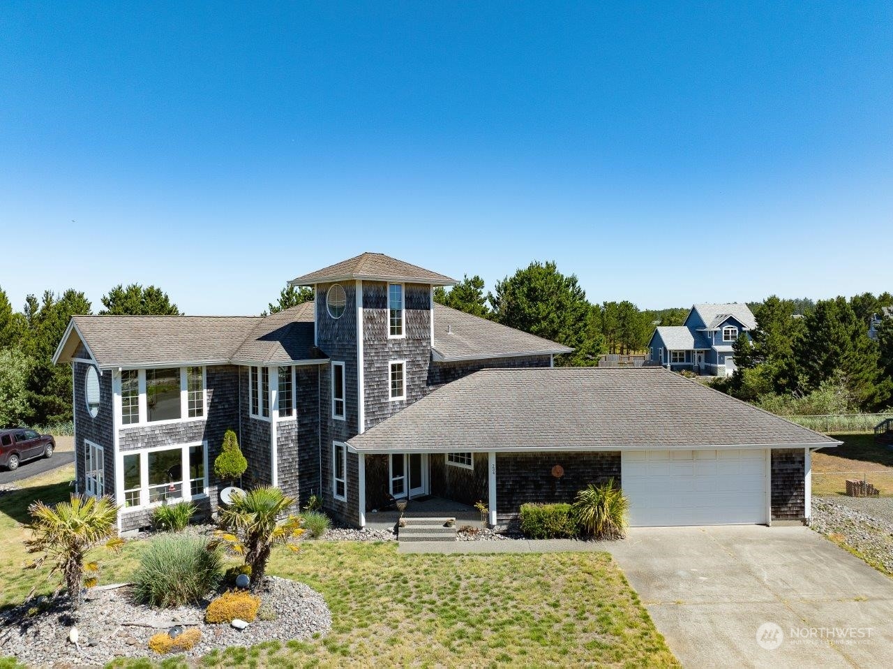 a front view of a house with garden