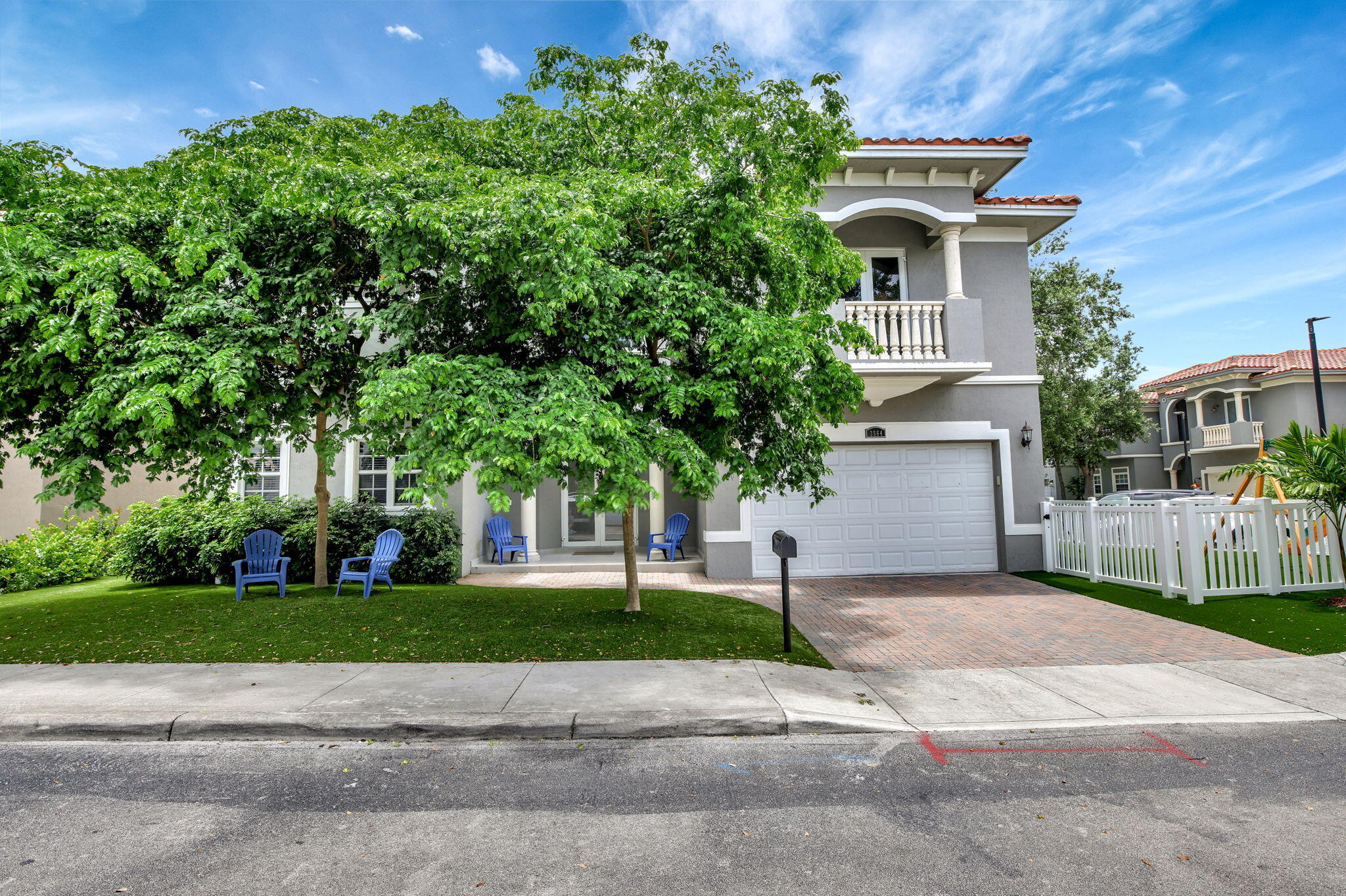 a view of a house with a yard and plants