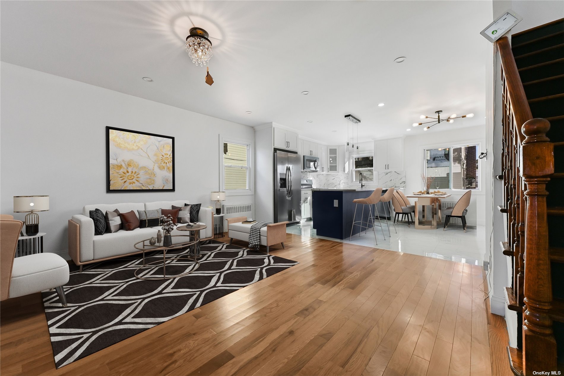 a living room with furniture a wooden floor and next to a window