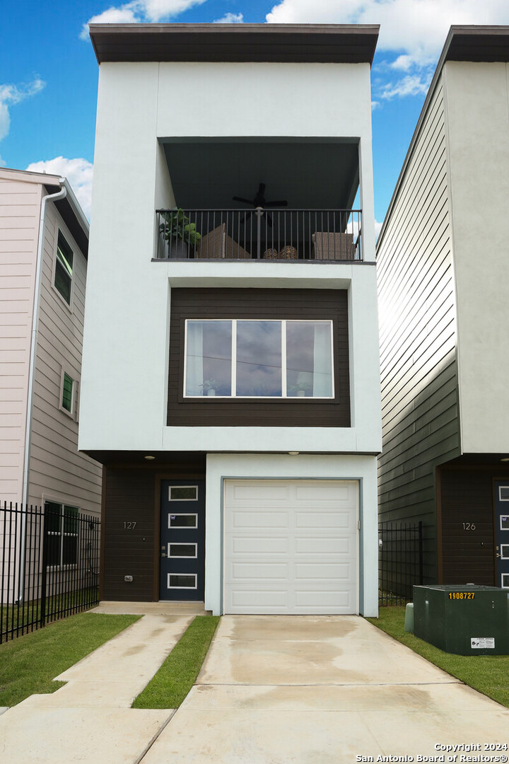 a front view of a house with a garage