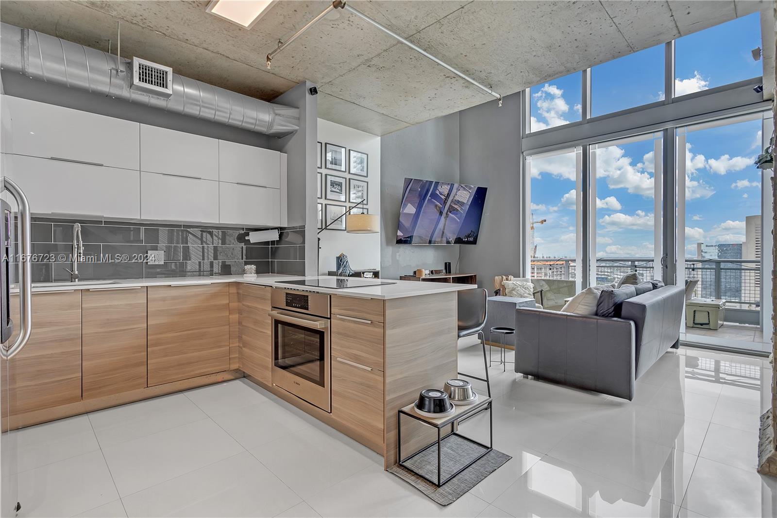 a kitchen with cabinets and window