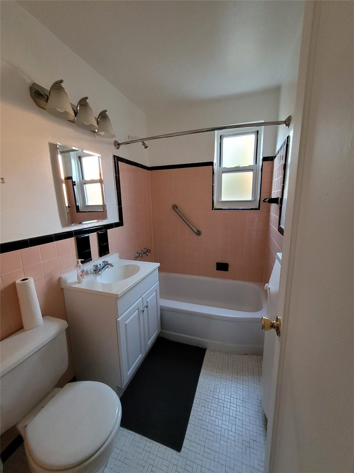 a bathroom with a toilet a sink and bathtub