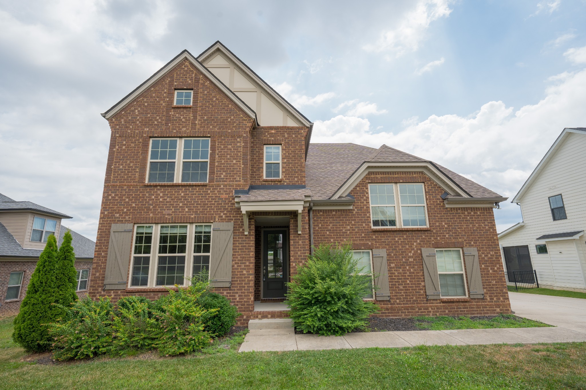 front view of a house with a yard