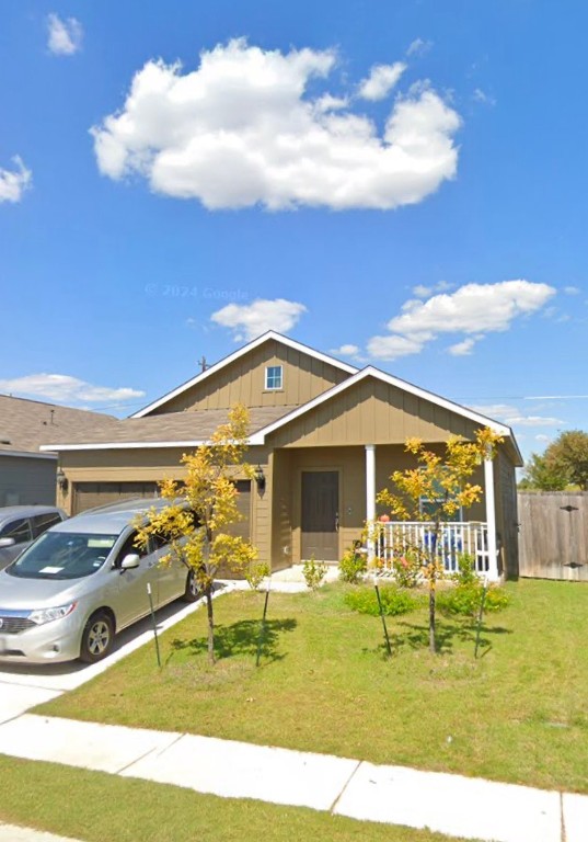 a view of a house with a big yard