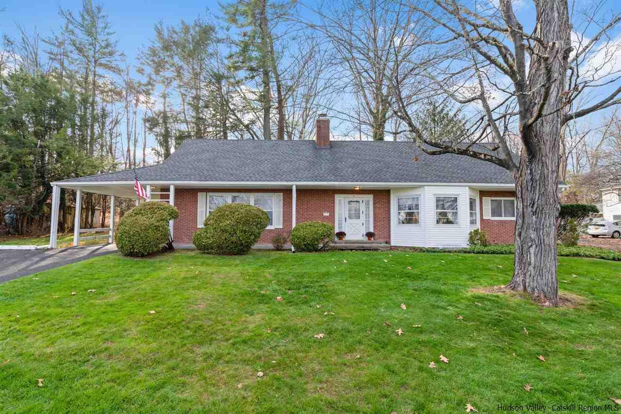 a view of a house with a backyard