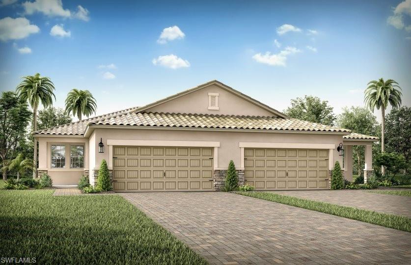 a front view of a house with a yard and garage