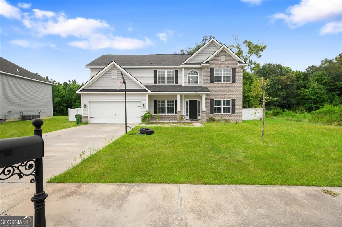 a front view of a house with a yard