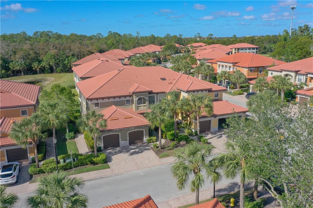 an aerial view of house with swimming pool outdoor seating and yard