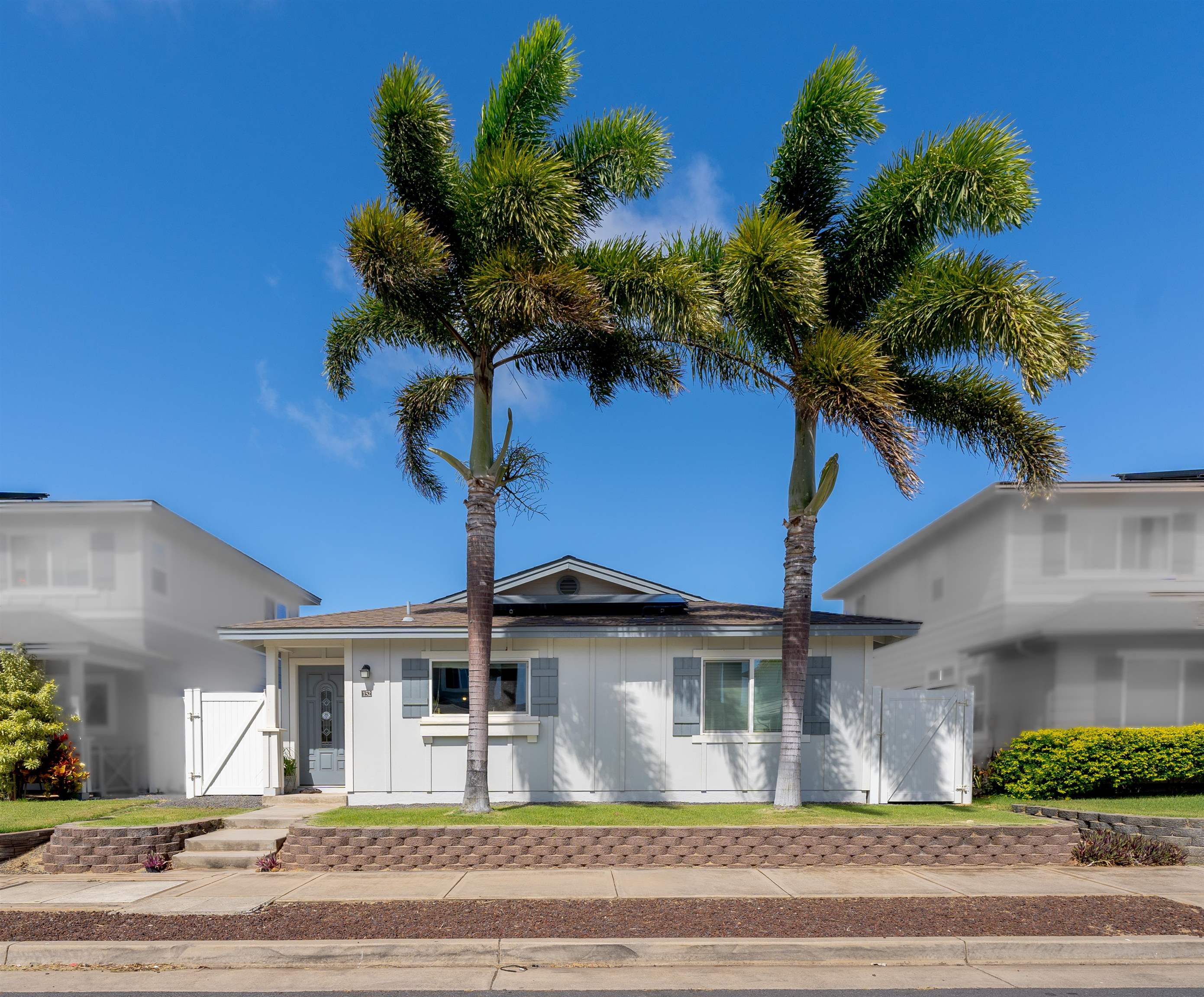 a front view of a house with a yard