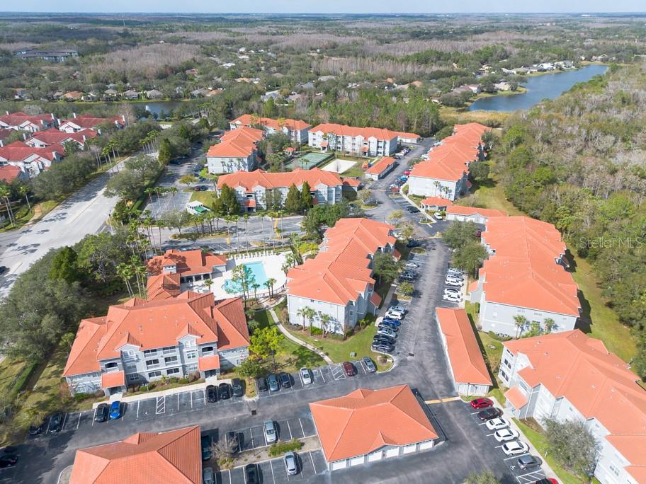 an aerial view of residential houses with outdoor space