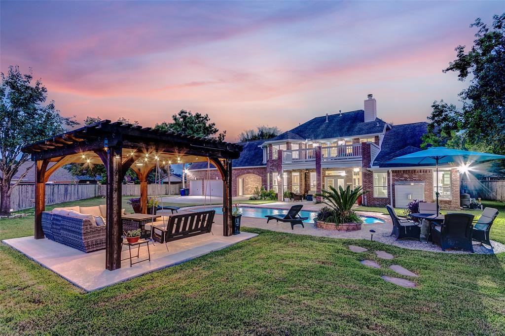 a view of swimming pool with outdoor seating