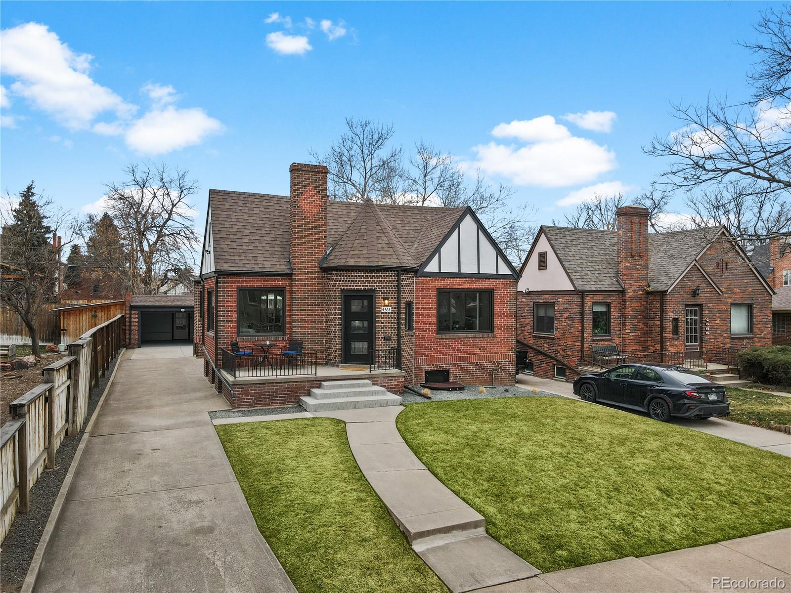 a view of house with yard outdoor seating and barbeque oven