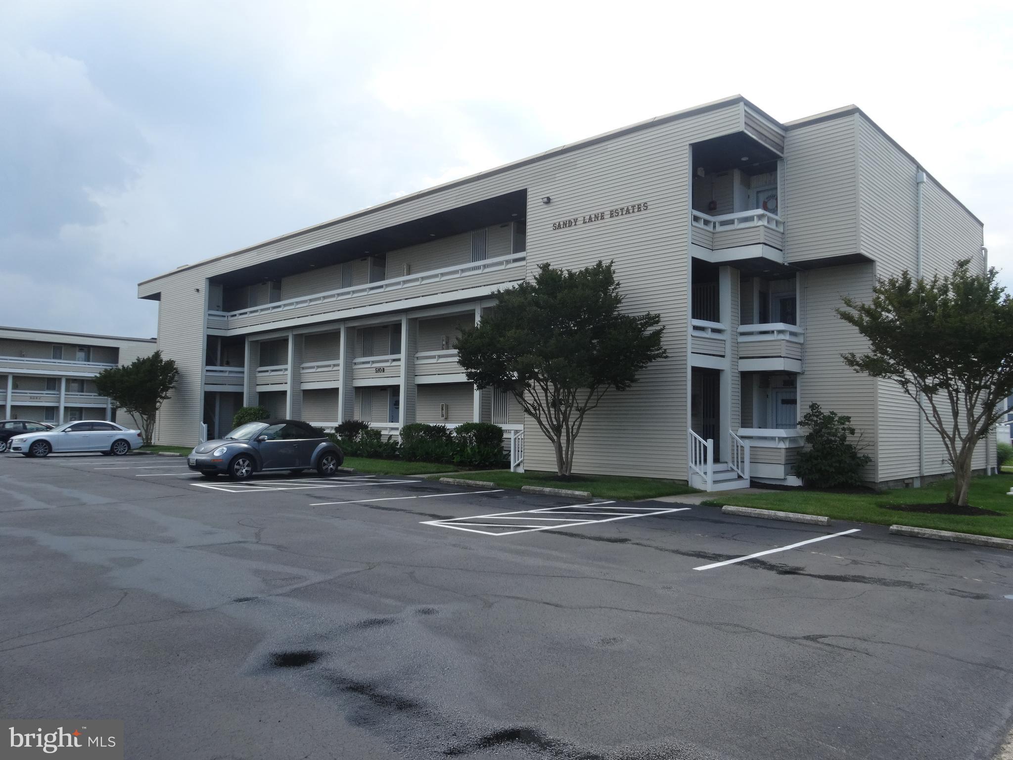 a view of a car park in front of house