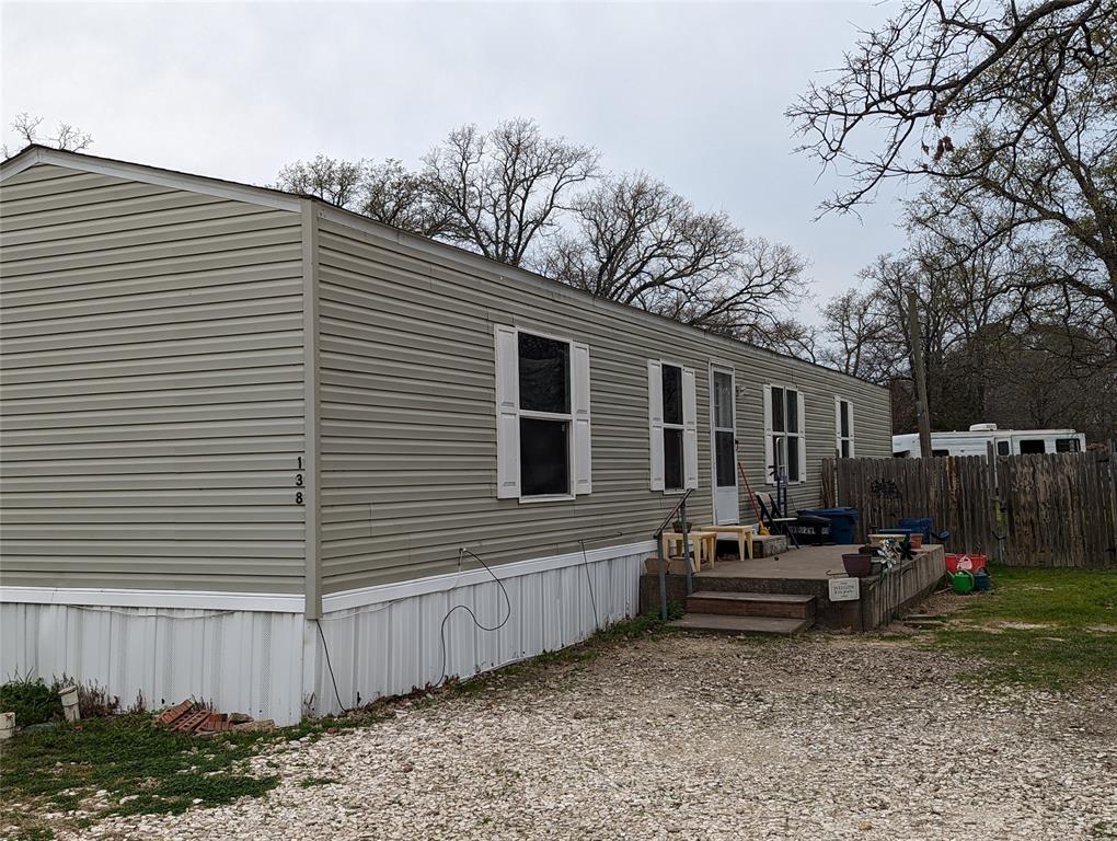 a house view with a backyard space