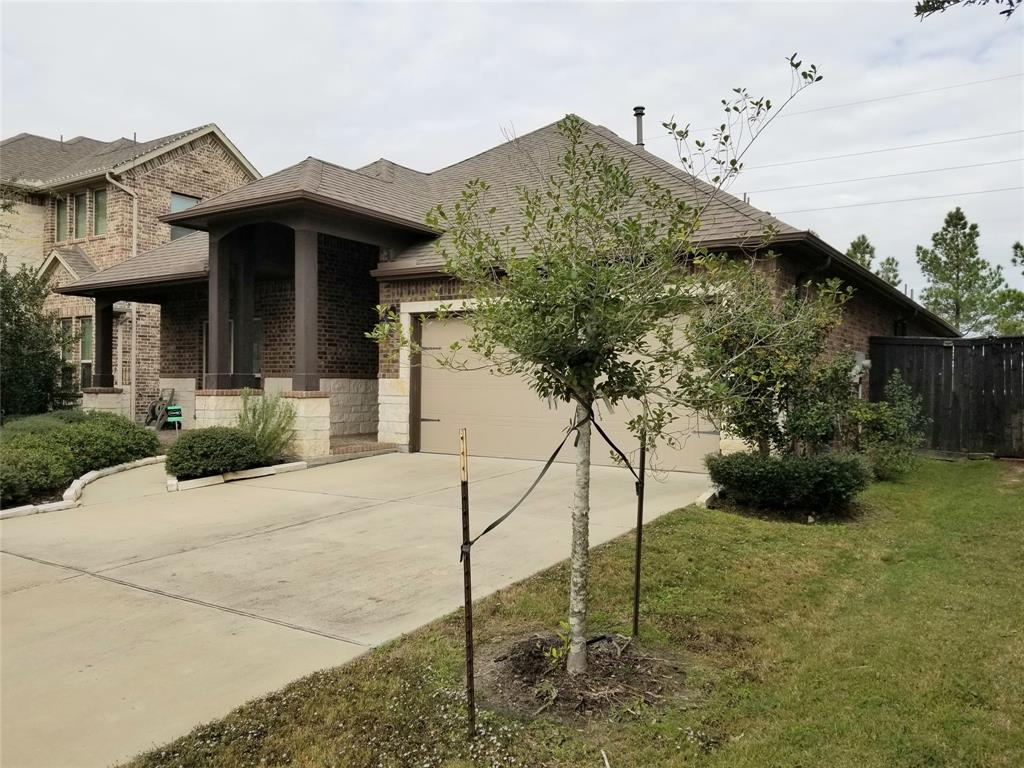 a view of a house with wooden fence