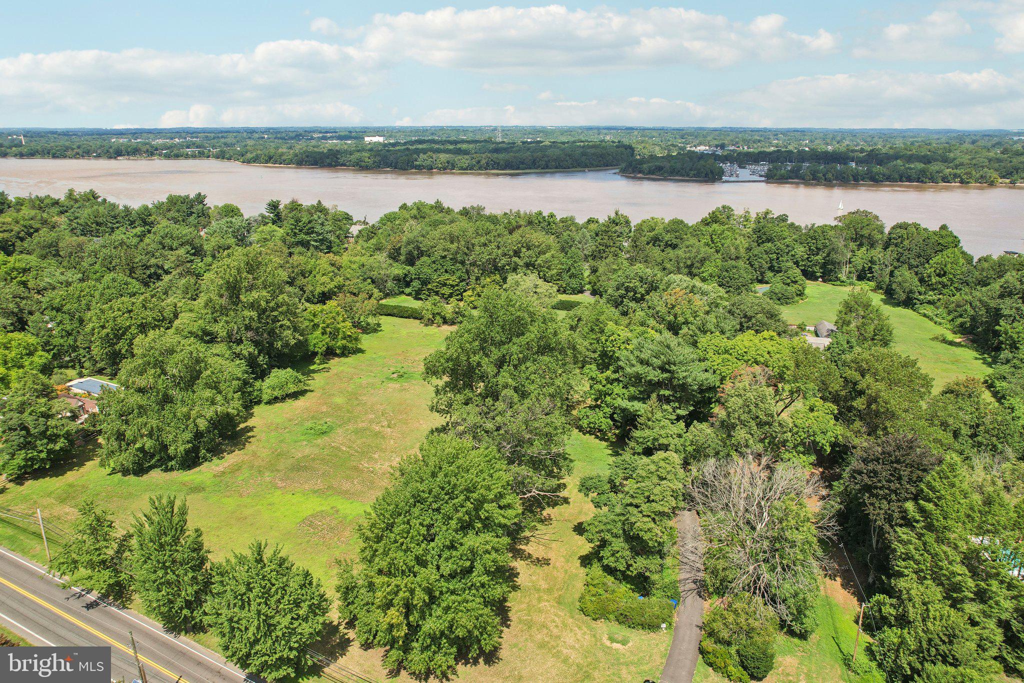 a view of a lake with houses in the back