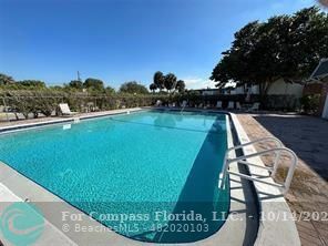 a view of a swimming pool and outdoor space