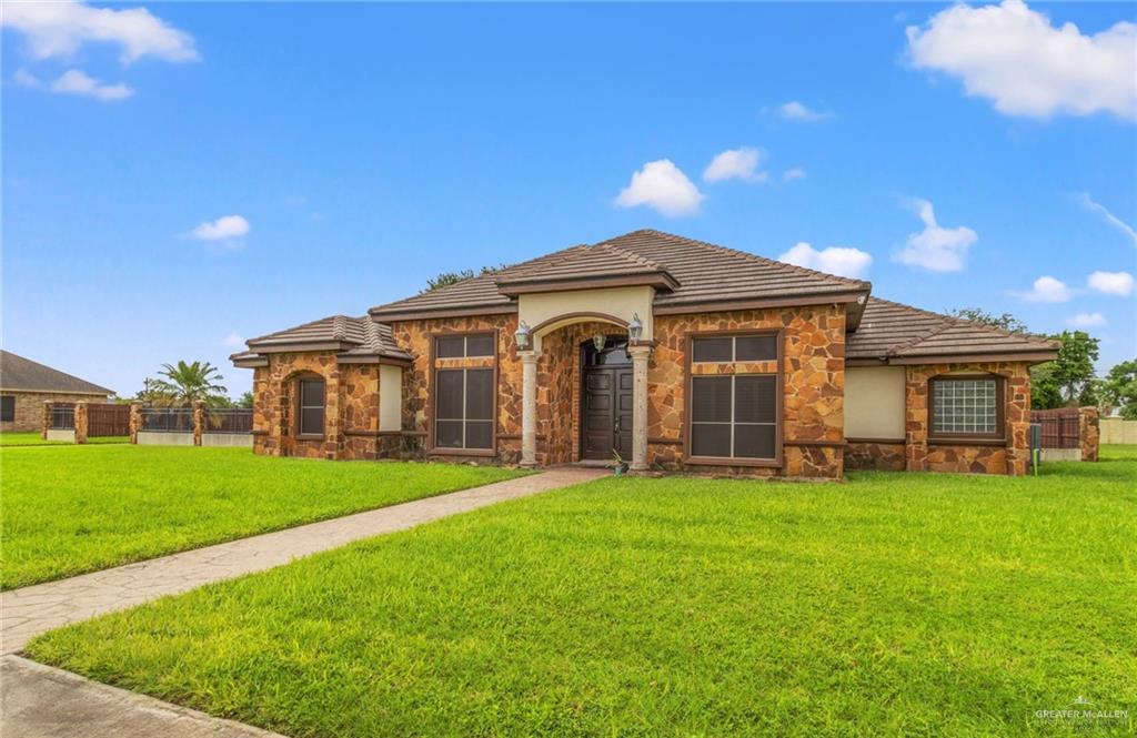 a front view of a house with a yard