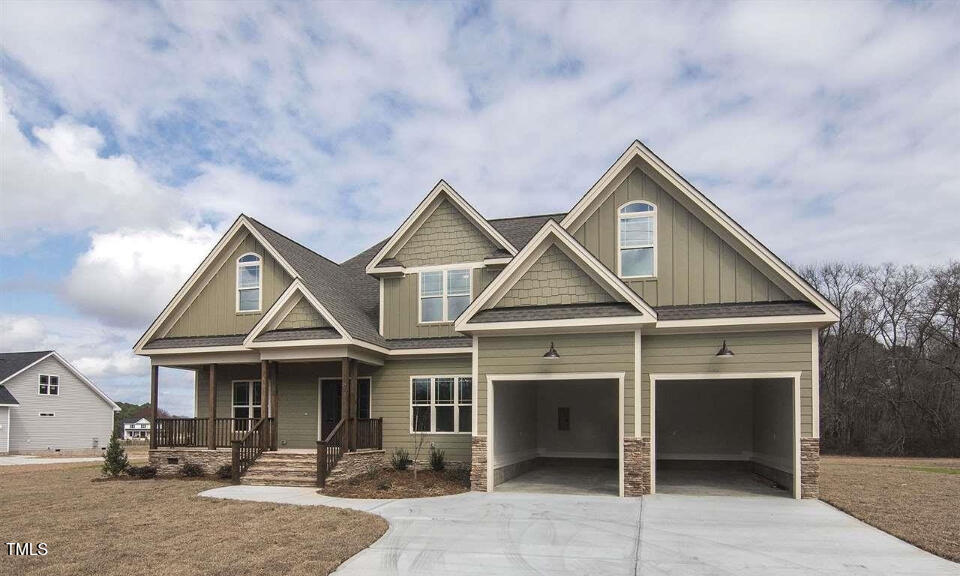 a front view of a house with garage