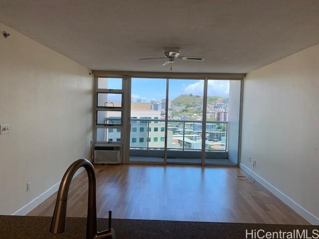 a view of room with furniture and floor to ceiling window