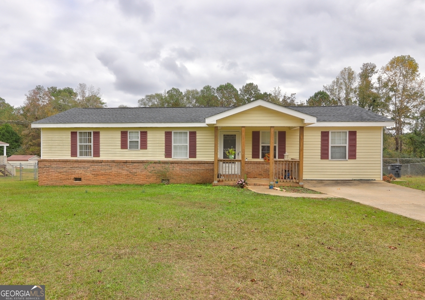 a front view of a house with a yard and porch