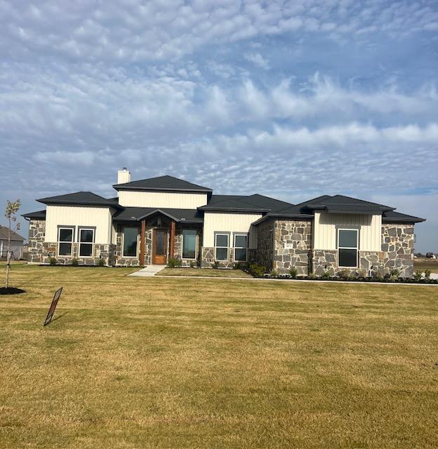 a front view of residential houses with yard and swimming pool