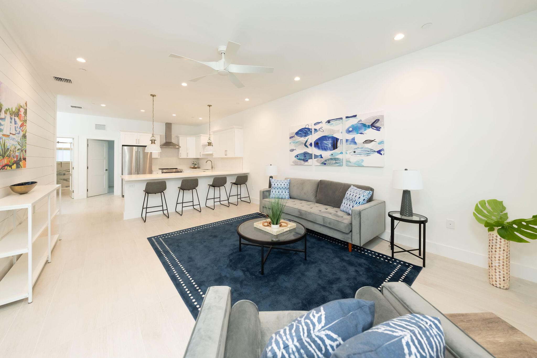 a living room with furniture and a rug