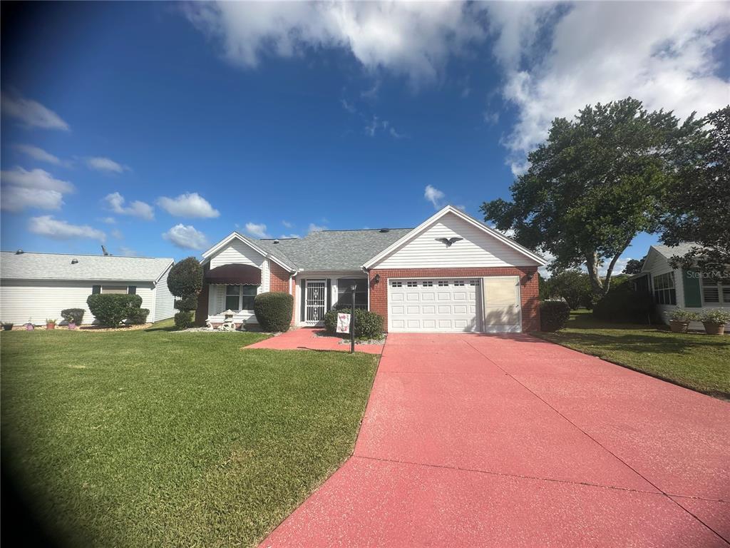 a front view of a house with yard