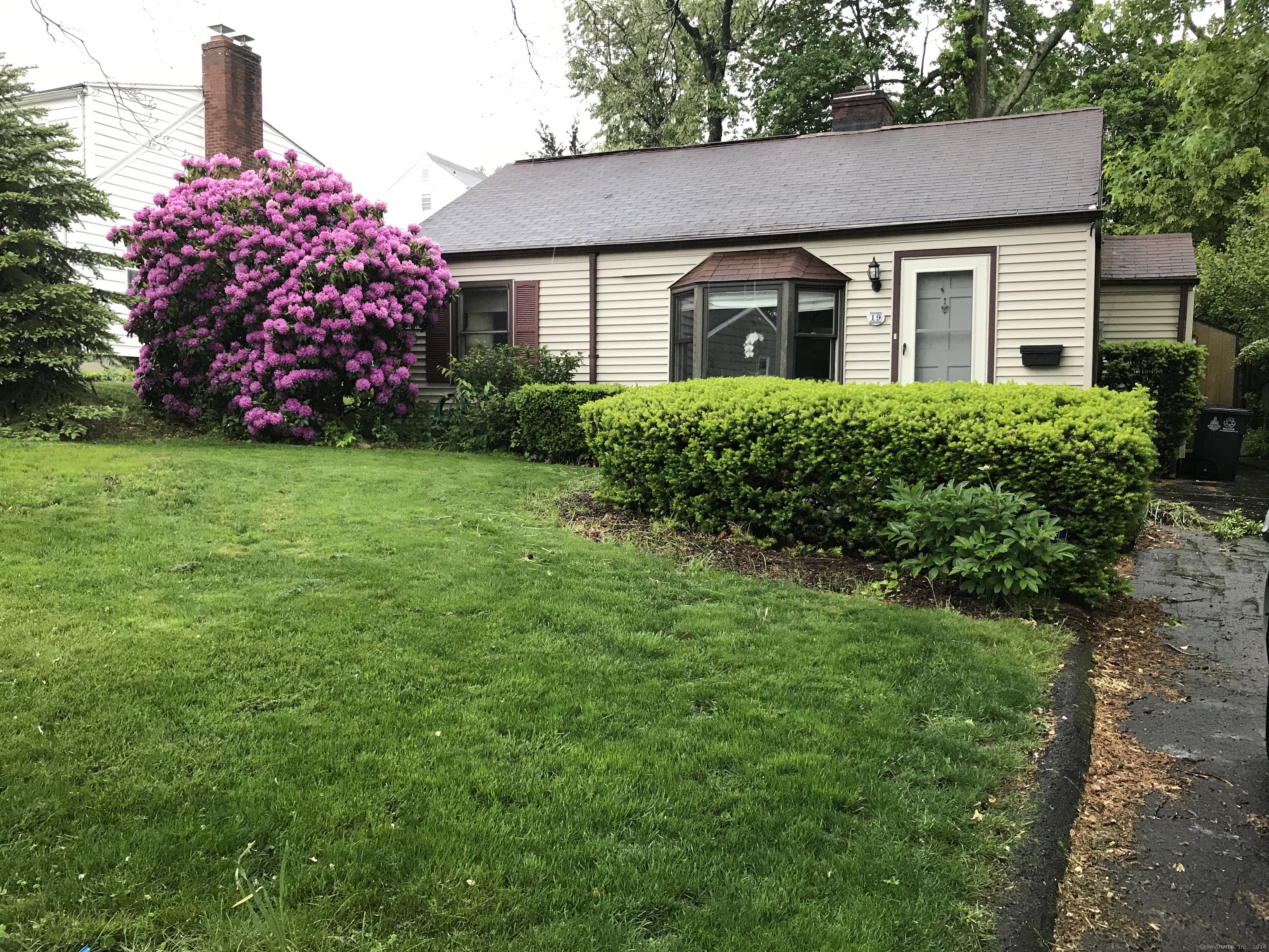 a front view of a house with garden