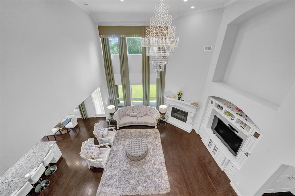 Spacious, high-ceilinged living room.