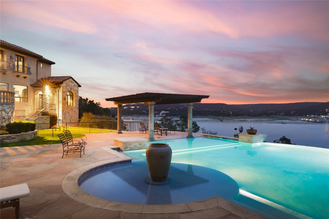 a view of a swimming pool with a patio