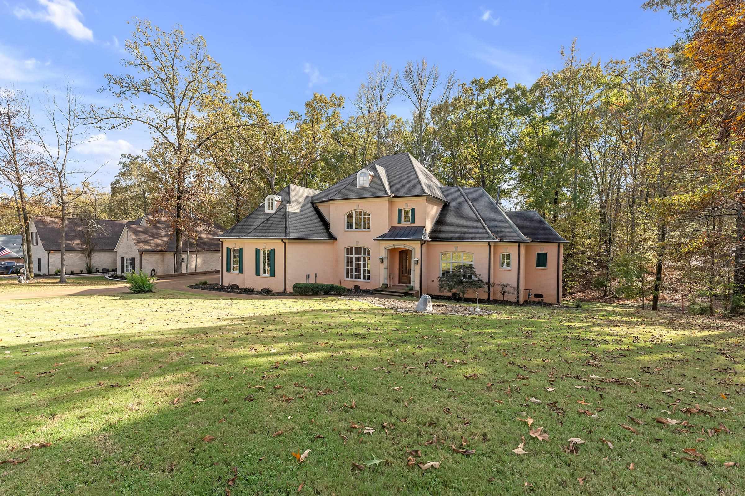 View of front of property featuring french doors and an expansive front lawn