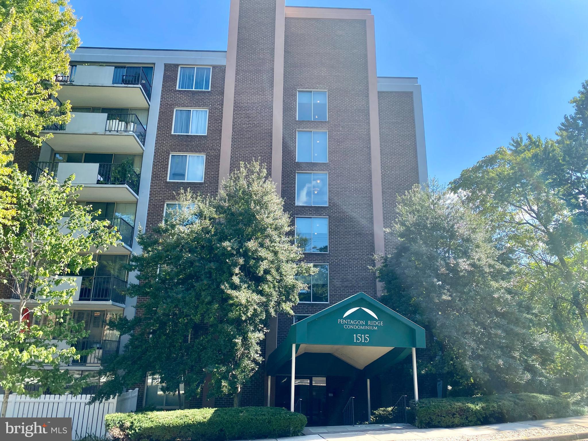 a view of a building with a yard