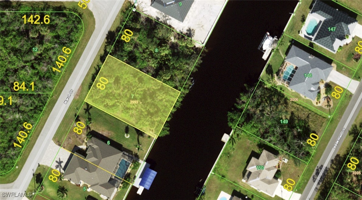 an aerial view of a residential houses with yard