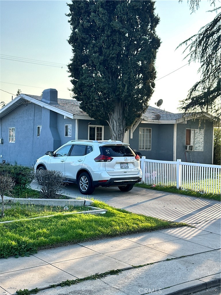 a view of a car parked in front of a house