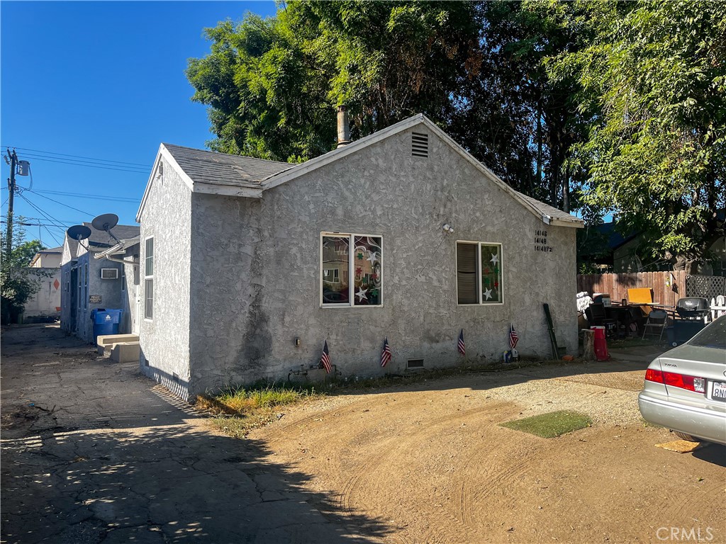 a house with trees in the background