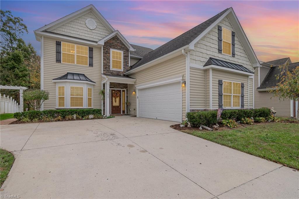 Front of home featuring a side load garage.