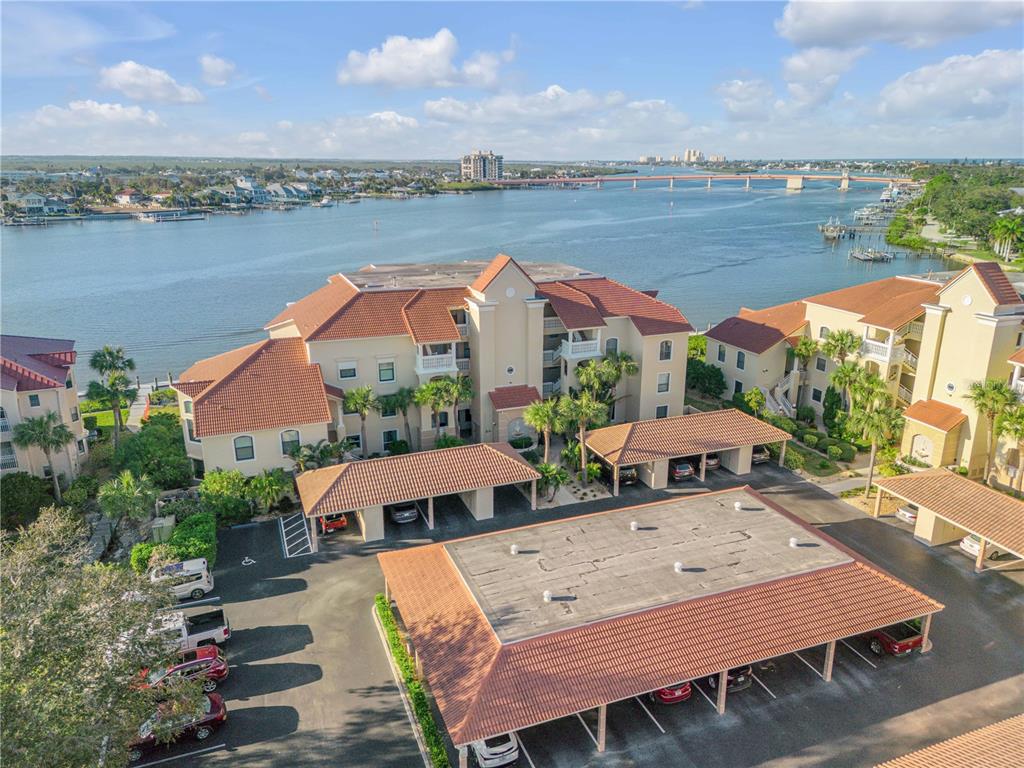 an aerial view of a house with pool and ocean view