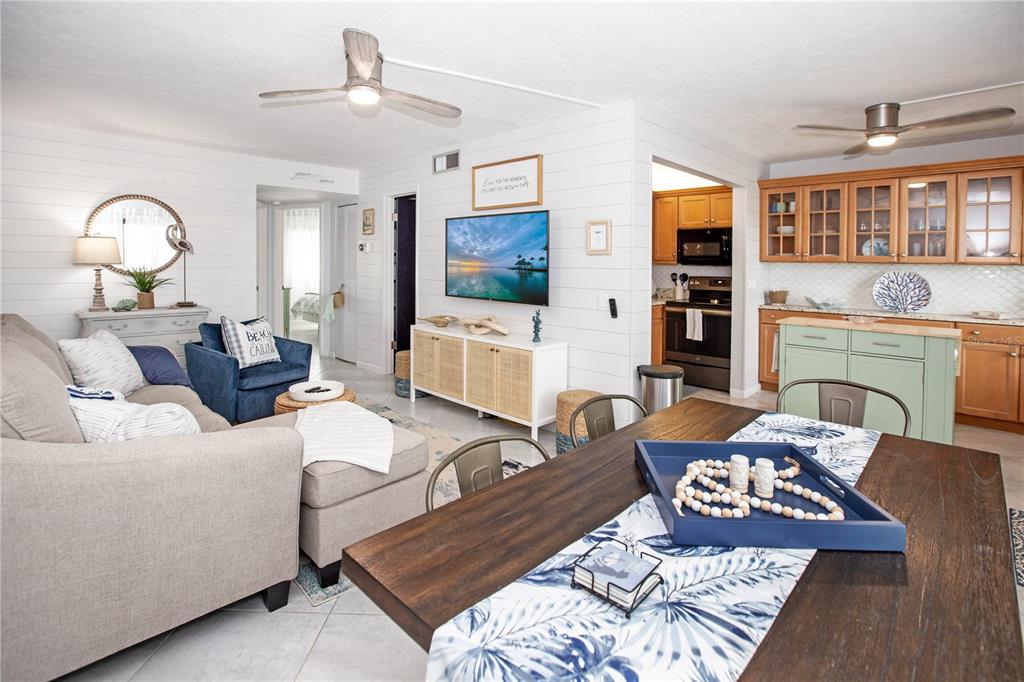 a living room with furniture fireplace and flat screen tv