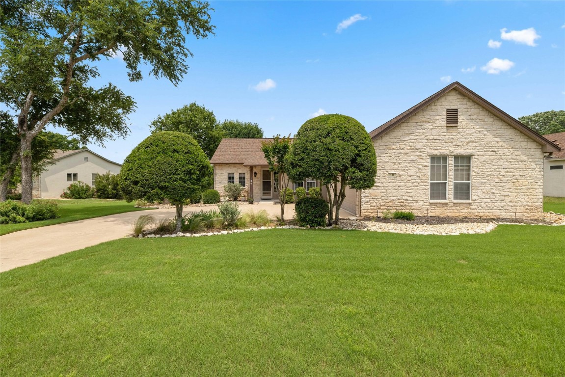 a view of a house with a backyard