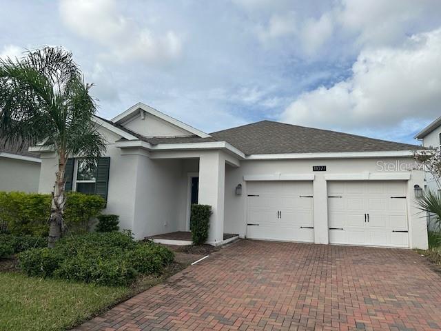 a house with white door and a garage