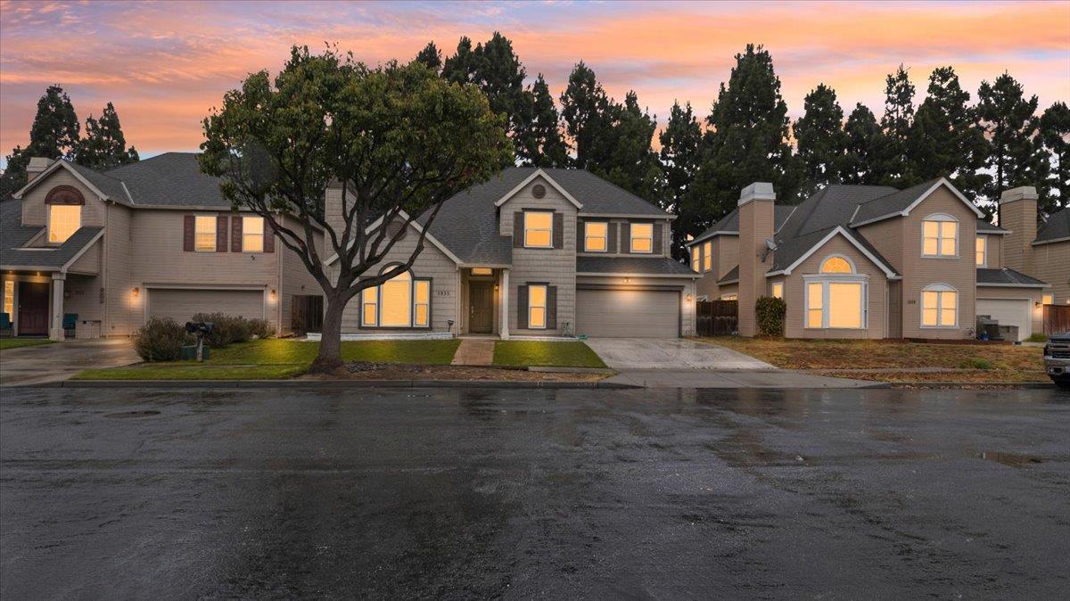 a front view of a house with a yard