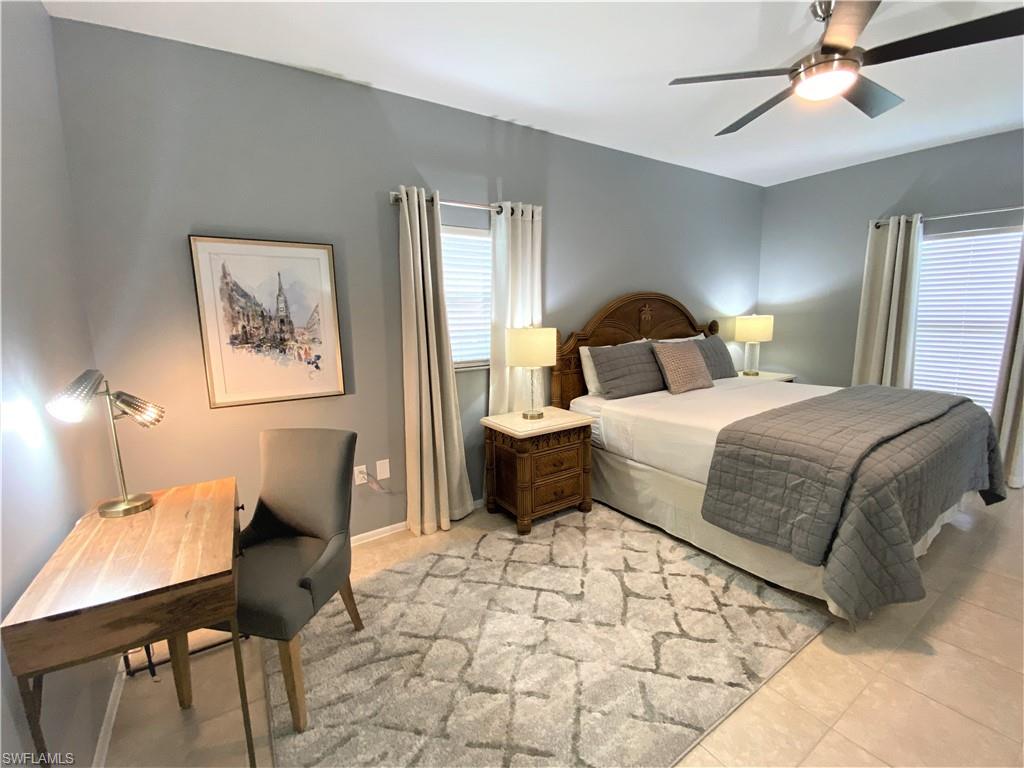 Tiled bedroom with ceiling fan