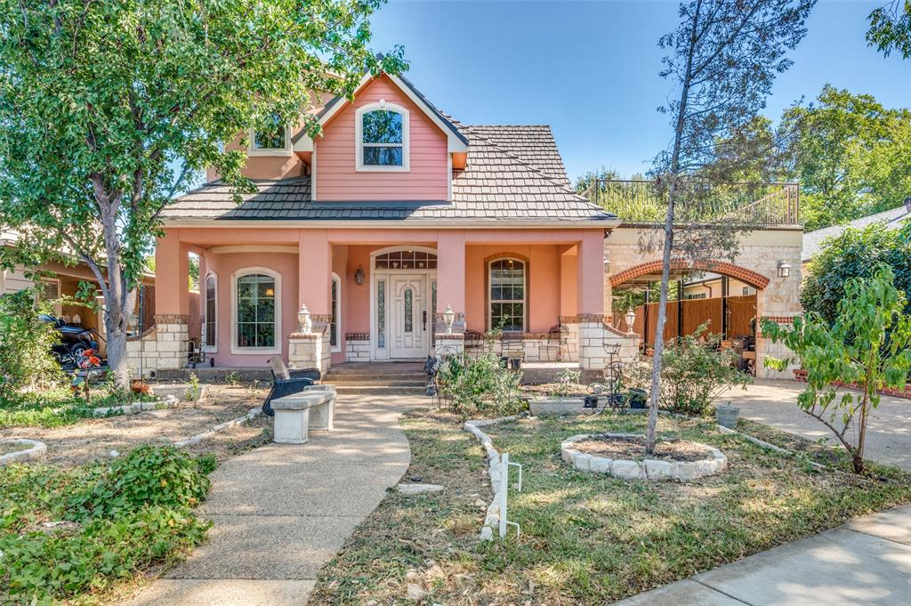 a front view of a house with garden