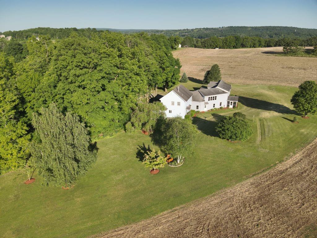 This is heaven with the best of both worlds.  Mature trees provide privacy in the front of the house while being surrounds by acres and acres of farmland!