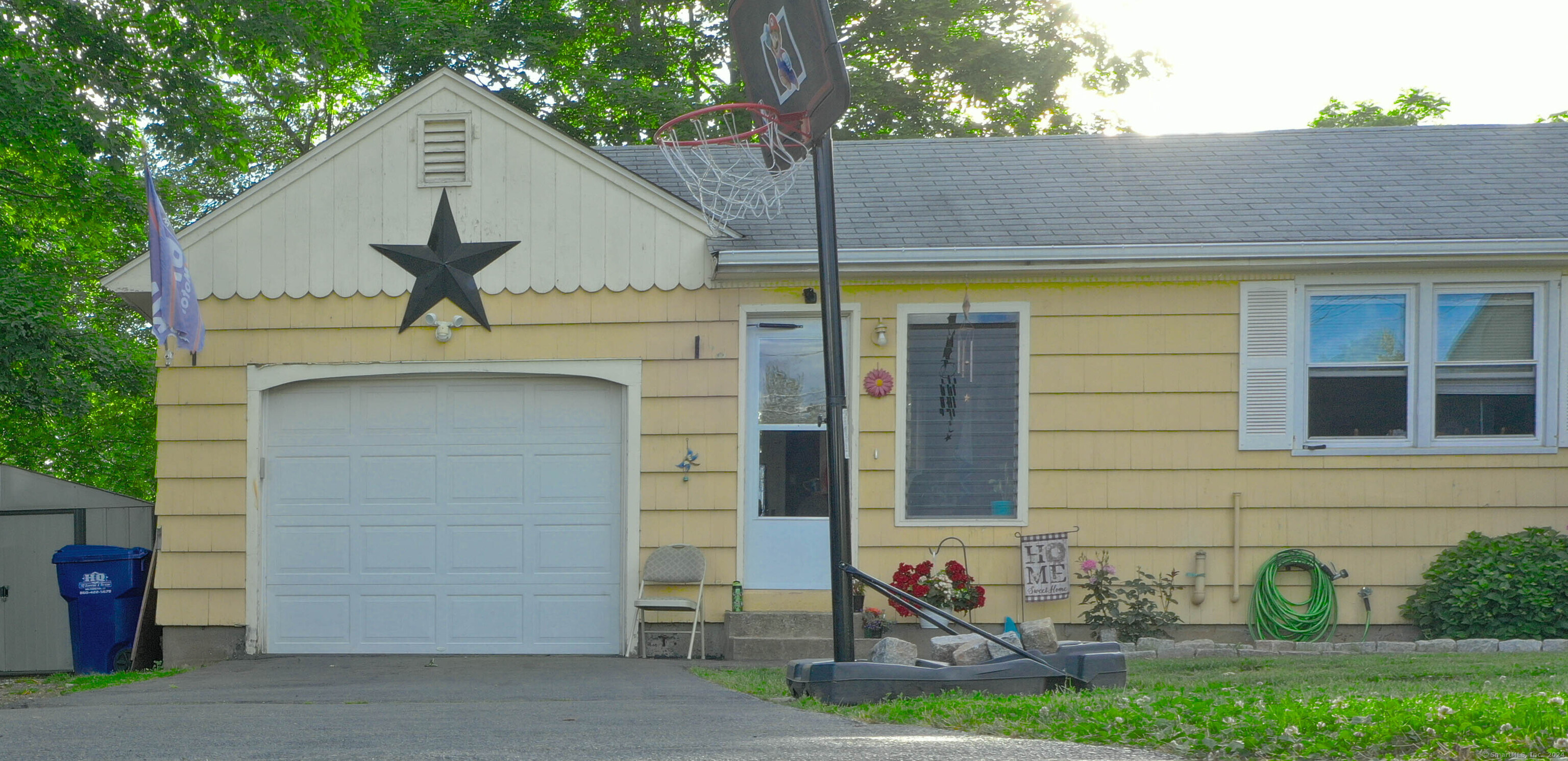 a front view of a house with garage