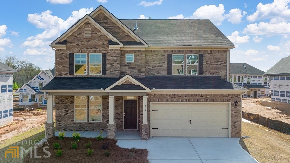 a front view of a house with a garage